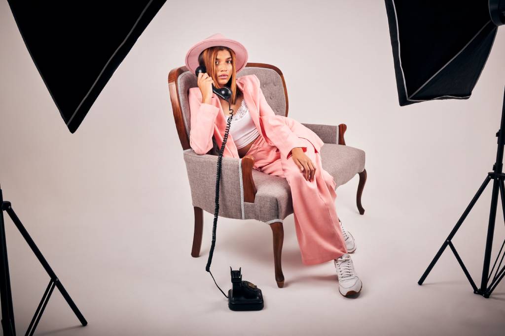 portrait woman fashion with telephone studio elegant clothes formal suit stylish photography confident girl relax with aesthetic hat softbox production white background 1